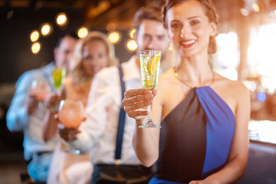 Young woman drinking glasses outdoors