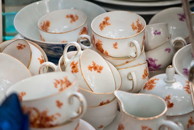 Close-up of cups on table