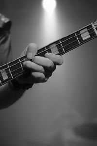 Cropped hand of person playing guitar