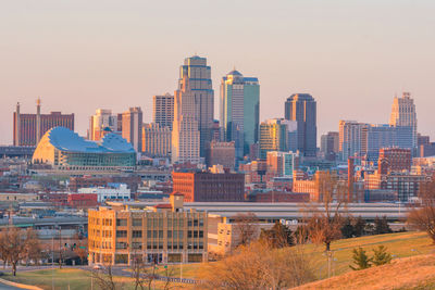 Modern buildings in city against sky