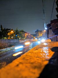 Surface level of light trails on road at night