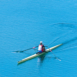 High angle view of athlete rowing on sea