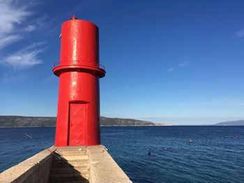 Lighthouse by sea coast