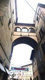 Low angle view of buildings in city against sky