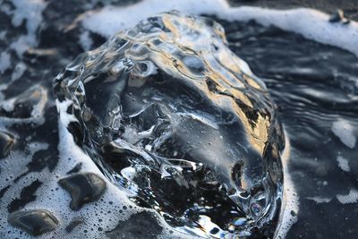 High angle view of ice on rock