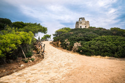 Footpath leading towards historic building