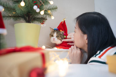 Close-up of girl with christmas decoration
