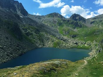 Scenic view of lake and mountains against sky