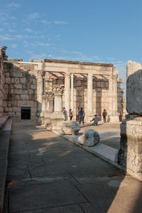 People in front of historical building