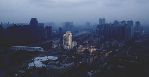 Aerial view of city lit up at night