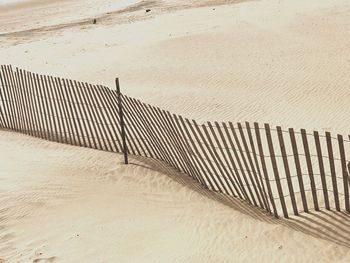 High angle view of fence on beach