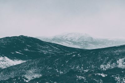 Scenic view of snowcapped mountains against clear sky