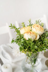 Close-up of flower vase on table