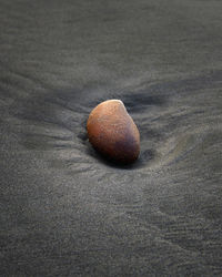 Close-up of pebbles on sand