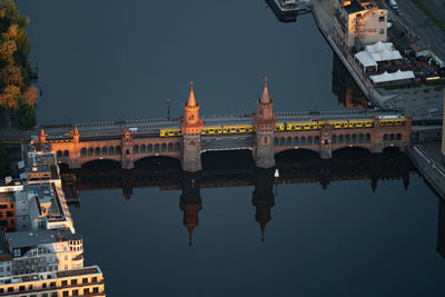 Arch bridge over river in city