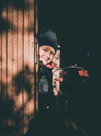 Portrait of cute boy holding camera