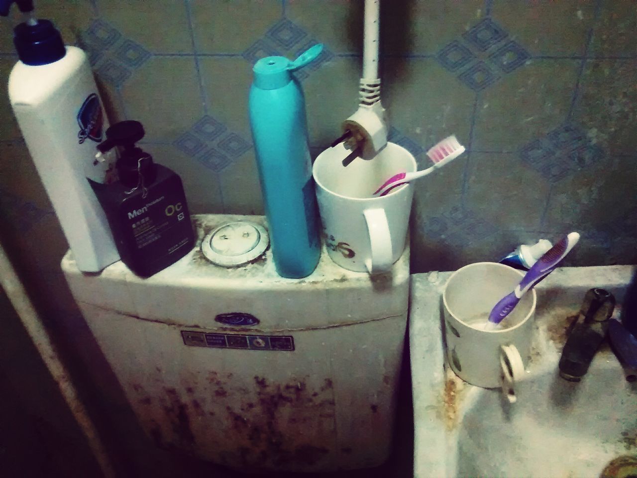 indoors, table, still life, wall - building feature, home interior, high angle view, bottle, variation, bathroom, messy, wood - material, domestic room, no people, hanging, hygiene, wall, reflection, flooring, domestic bathroom, absence