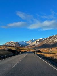 Empty road against sky