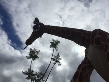 Low angle view of statue against sky