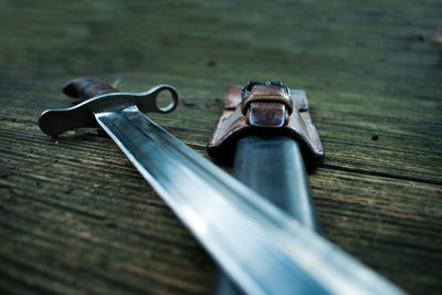 Close-up of metal on table