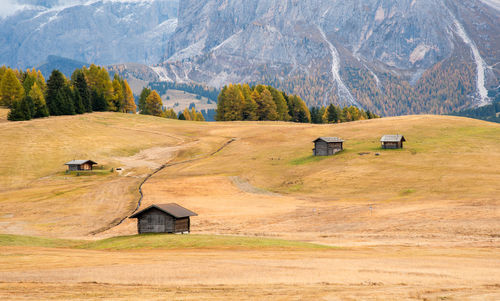 Scenic view of farm against mountain range