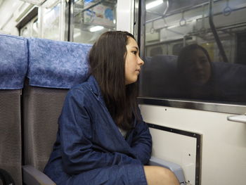 Side view of young woman looking away