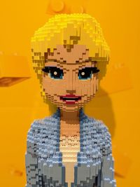Digital composite image of toy against orange background