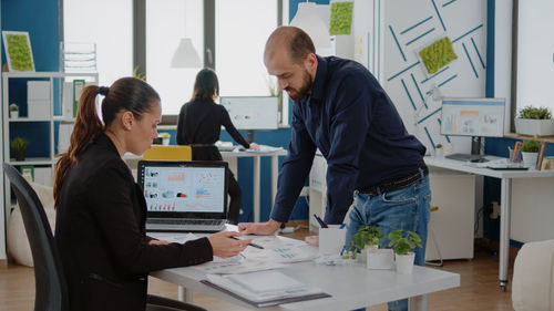 Business colleagues brainstorming in office