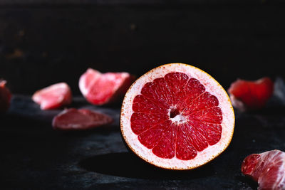 Close-up of strawberry over black background