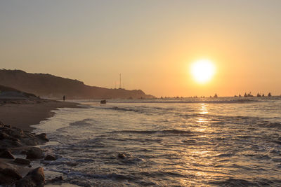 Scenic view of sea against sky during sunset