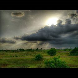 Scenic view of landscape against cloudy sky