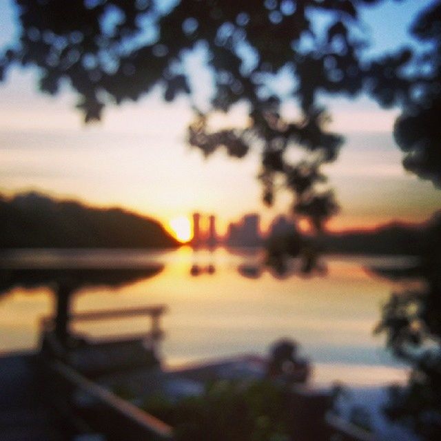 sunset, water, silhouette, lake, sky, transportation, nautical vessel, mode of transport, boat, focus on foreground, tranquility, nature, river, scenics, tranquil scene, reflection, beauty in nature, tree, orange color, sea