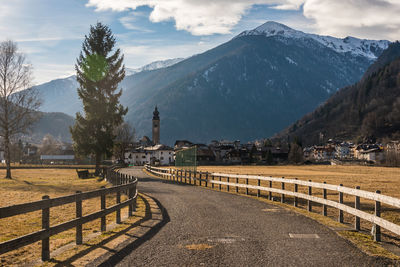 Scenic view of snowcapped mountains against sky. small italian village. 