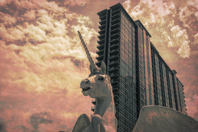 Low angle view of horse statue against building