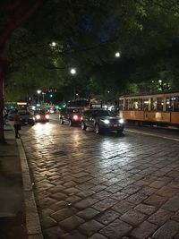 Illuminated city street at night