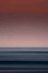 Scenic view of sea against clear sky during sunset