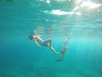 People swimming in sea