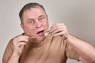 Portrait of man eating food