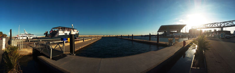 Panoramic shot of harbor against clear blue sky