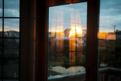 Sunrise reflected on the windows of a beach home