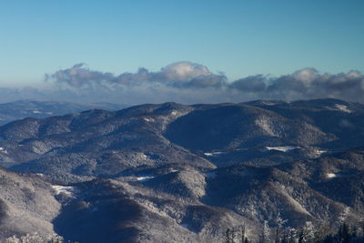 Scenic view of mountains against sky during winter