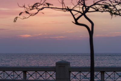 Scenic view of sea against sky at sunset