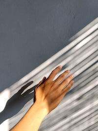 Close-up of hand on wall