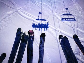 Low angle view of ice hanging against sky