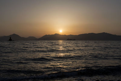 Scenic view of sea against sky during sunset