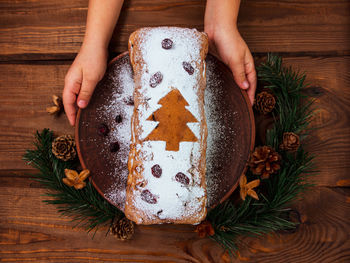 Midsection of christmas tree on table