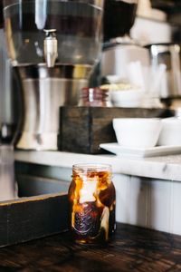 Close-up of drink in mason jar on table at home