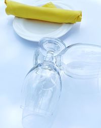 Close-up of water bottle on table against white background