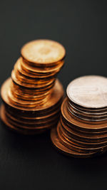 Close-up of coins on black background