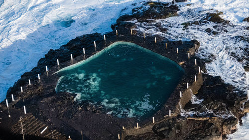 High angle view of rocks in water